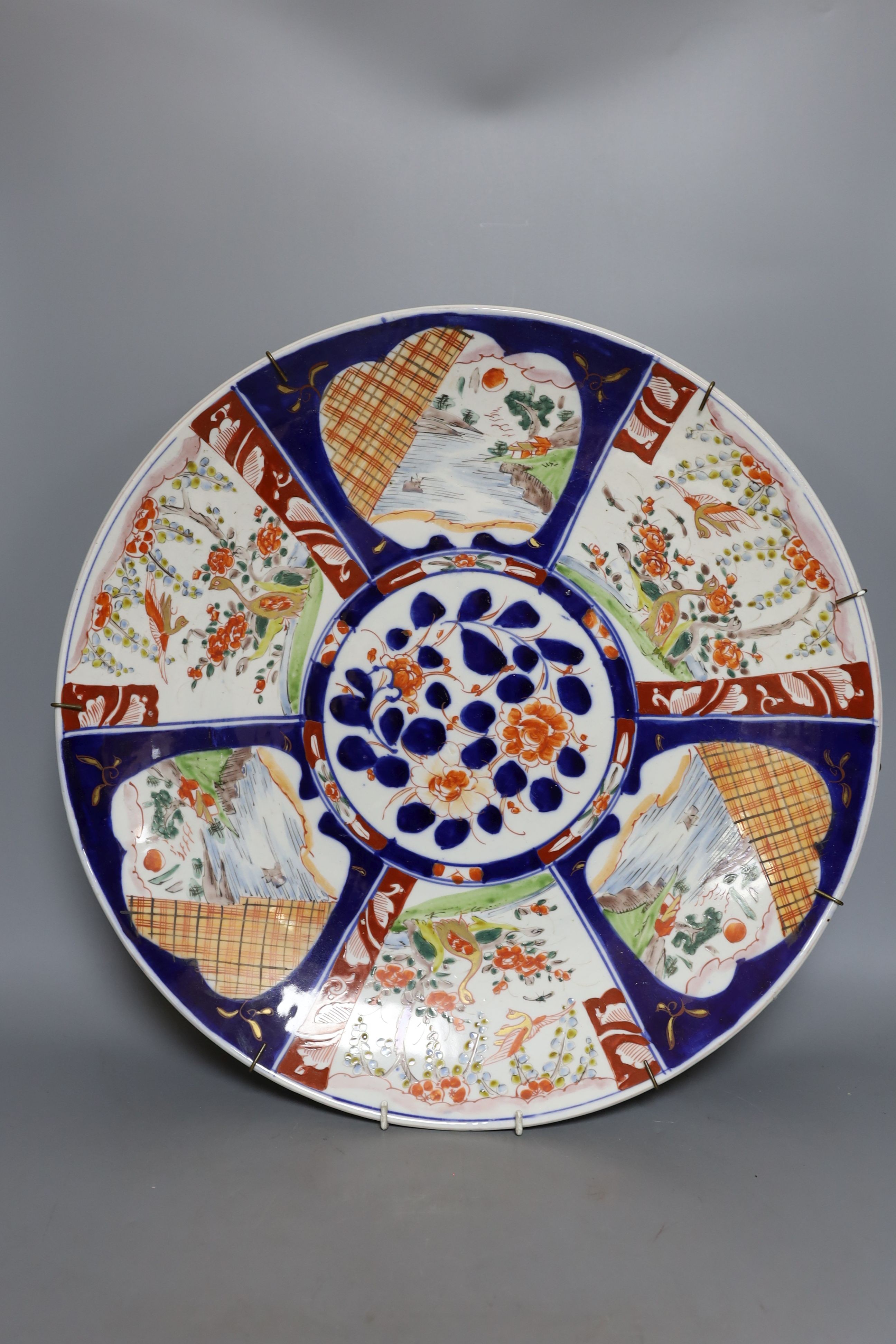 Two Imari dishes, largest 45cm., and an Imari bowl